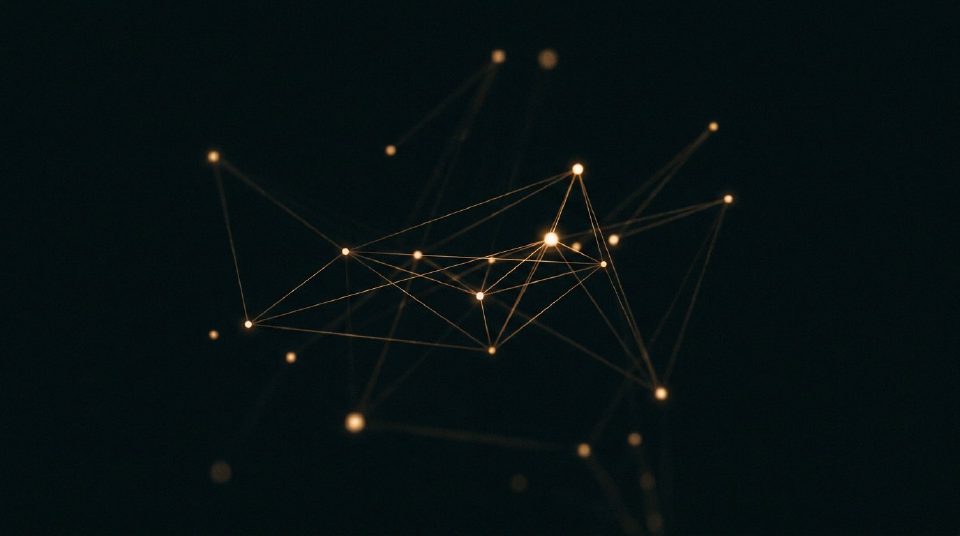 A constellation of glowing gold nodes joined by threads of light