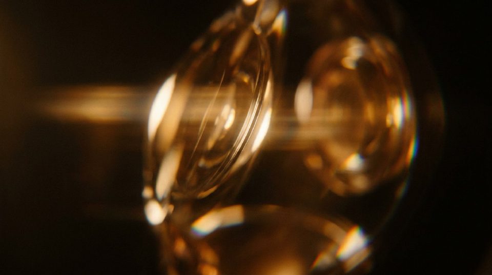 Golden light refracting through stacked lens elements